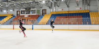 Synchronized figure skaters training on an ice rink