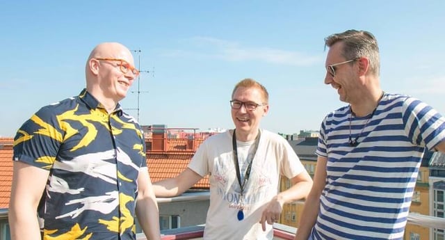 Three happy men celebrating 