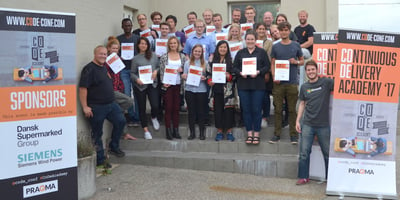 Students holding their diplomas from the Continuous delivery Academy in Aarhus