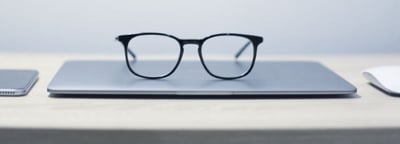 glasses on the table reflecting looking ahead