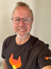 A selfie of Mattias Söderberg, Solutions Architect Nordics Region at GitLab, wearing a dark gray t-shirt with an orange GitLab logo.