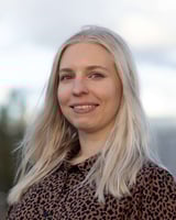 A portrait picture of Vilma Pohjonen wearing a brown leapard prinetd shirt.